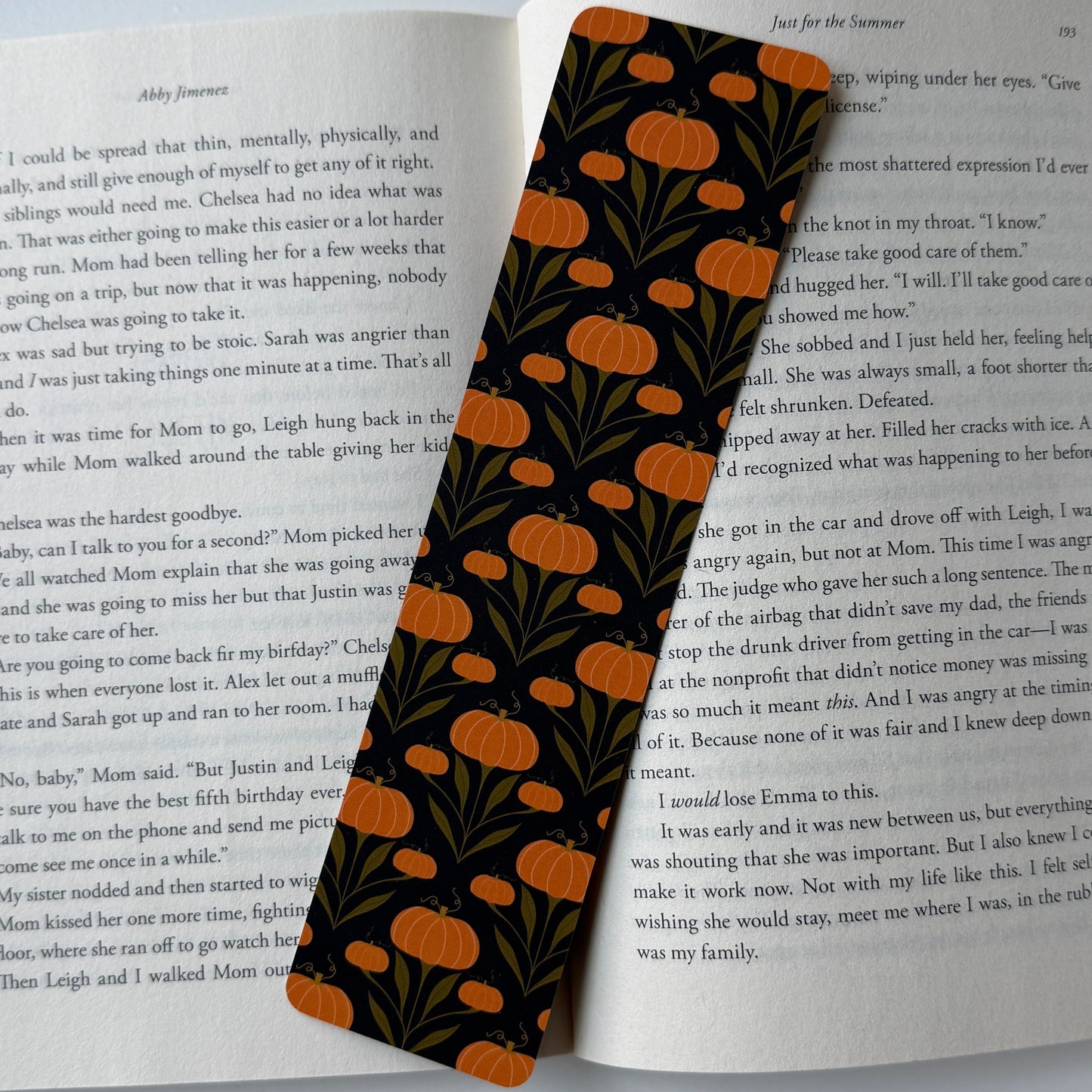 Black floral bookmark on an open book
