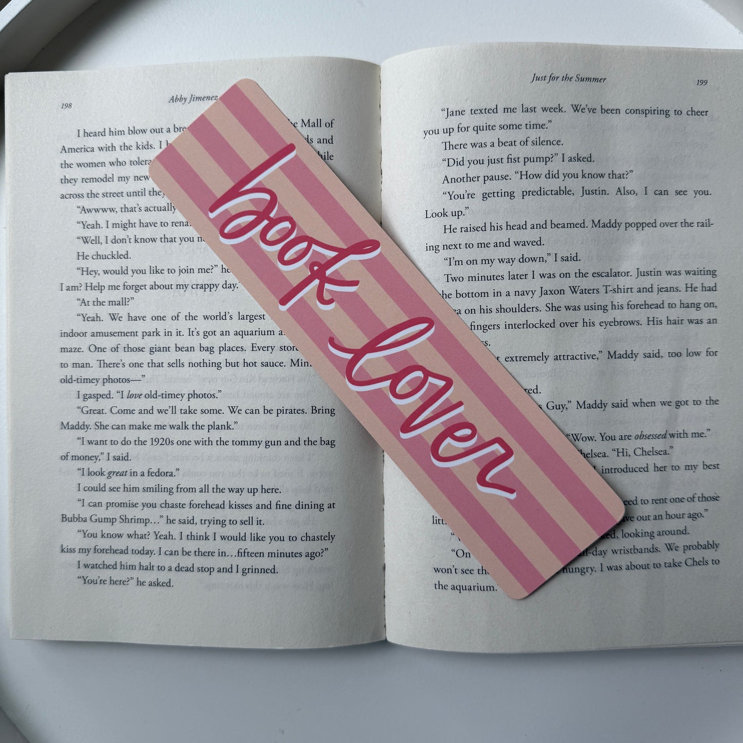 Pink bookmark with 'book lover' text on an open book