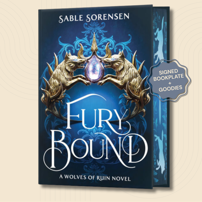 The book cover of 'Fury Bound' by Sable Sorensen, featuring a dark blue background with ornate blue filigree, two gold wolf heads, and a central purple gem. A silver badge on the right reads 'SIGNED BOOKPLATE + GOODIES'.