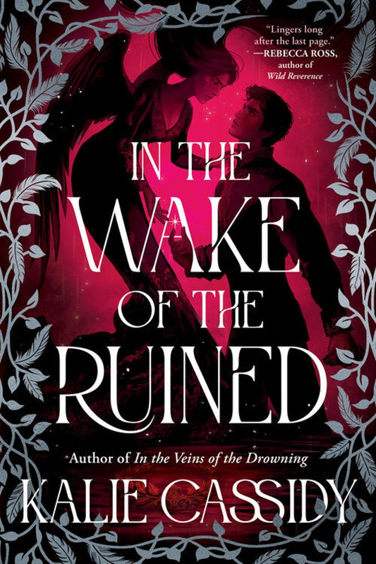 Book cover of 'In the Wake of the Ruined' with a silhouette of two people against a red background.
