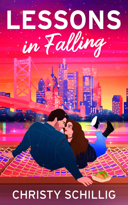 Book cover of 'Lessons in Falling' with a city skyline and couple embracing.