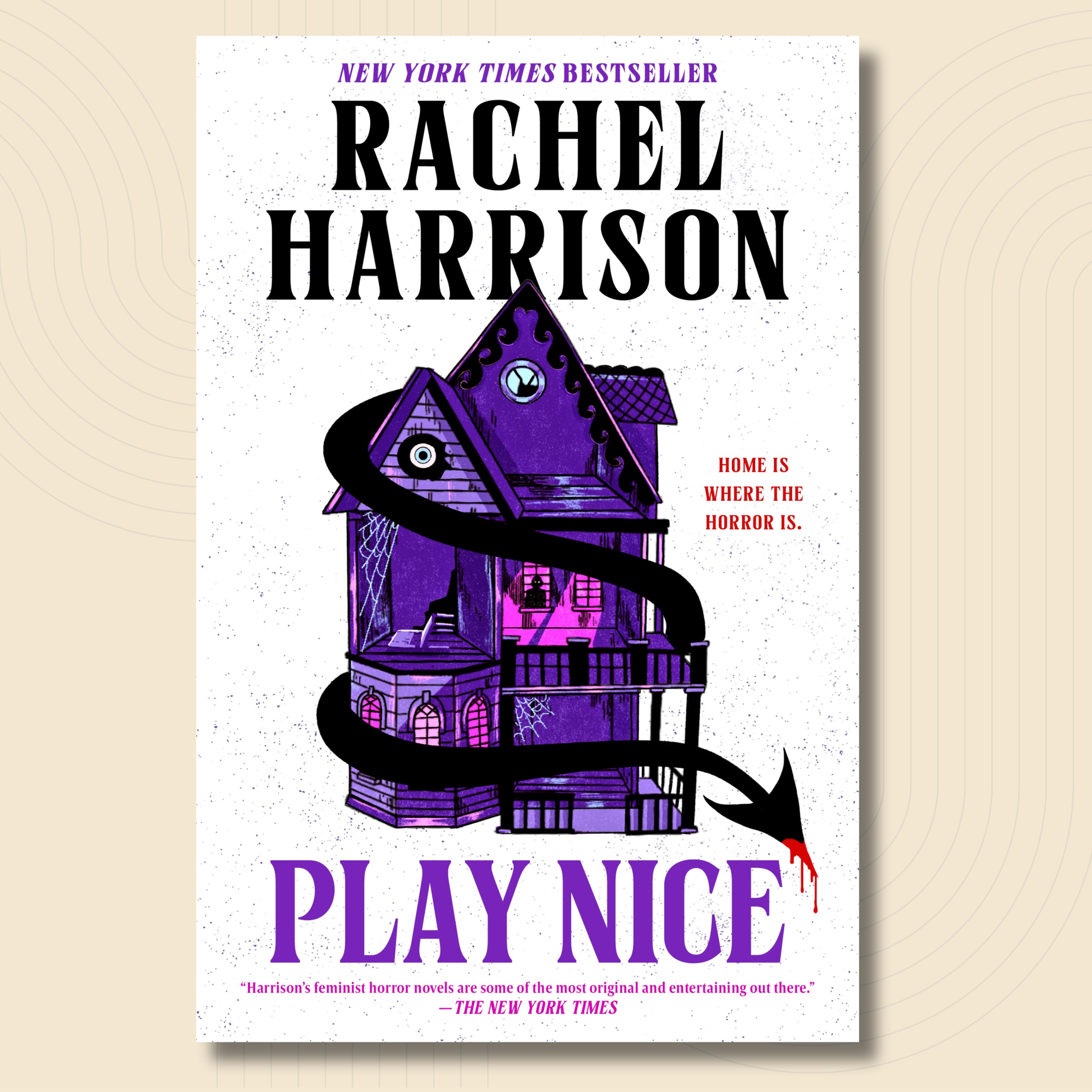 Book cover for 'Play Nice' by Rachel Harrison, featuring a white background with a purple illustrated haunted house and black snake graphic, on a beige textured backdrop.