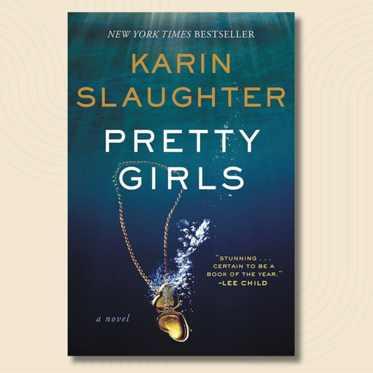 Book cover for the novel 'Pretty Girls' by Karin Slaughter, featuring a dark blue underwater design with a gold heart-shaped pendant and white and gold text.