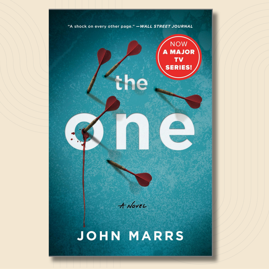 Book cover for the novel 'The One' by John Marrs, featuring a textured teal background with white title lettering, several red-and-black darts, and a red circular badge that says 'Now a Major TV Series!'.