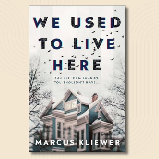 Book cover for 'We Used to Live Here' by Marcus Kliewer, featuring a large teal Victorian house on a snowy white background with silhouetted trees and birds, shown against a light beige textured backdrop.