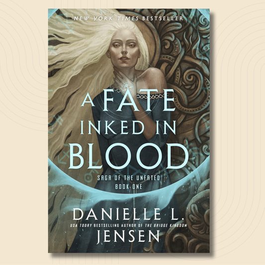Book cover for 'A Fate Inked in Blood' by Danielle L. Jensen, featuring an illustrated woman with long white hair against a dark teal and brown ornate background, centered on a light beige textured backdrop.