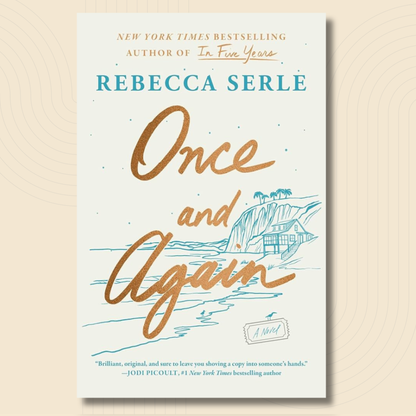Book cover for 'Once and Again' by Rebecca Serle, featuring a cream background with gold and teal typography and a blue coastal house illustration, shown against a warm beige background with subtle concentric circle patterns.