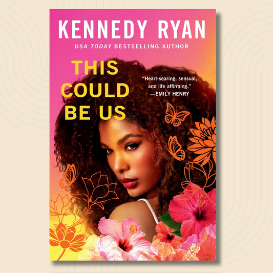 Book cover for 'This Could Be Us' by Kennedy Ryan, featuring a portrait of a woman with voluminous curly hair, surrounded by pink hibiscus flowers and orange butterfly line art on a pink-to-yellow gradient background.