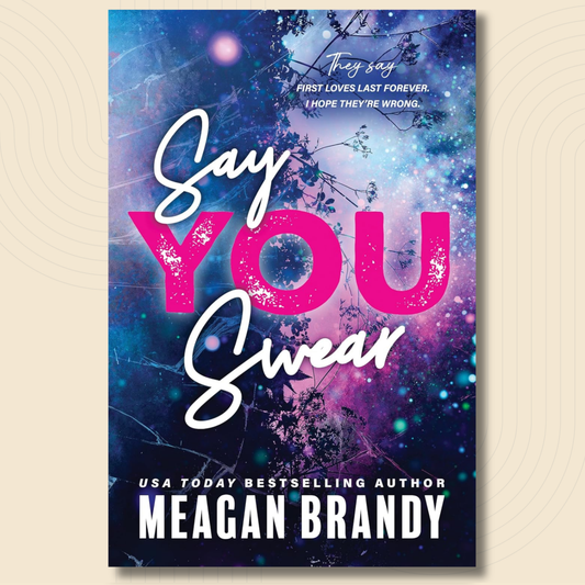 Book cover for 'Say You Swear' by Meagan Brandy, featuring a cosmic blue and purple galaxy background with white and pink typography.