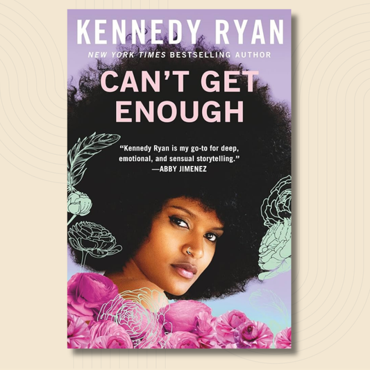 Book cover for 'Can't Get Enough' by Kennedy Ryan, featuring a portrait of a woman with an afro, pink flowers, and a lavender background, shown against a light beige textured backdrop.