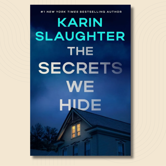 Book cover for 'The Secrets We Hide' by Karin Slaughter, featuring a dark blue night sky and a house with a lit window, shown on a light beige background with subtle concentric circle patterns.
