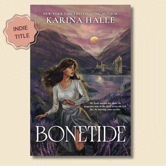 Book cover for the novel 'Bonetide' by Karina Halle, featuring an illustrated fantasy scene of a woman in a white dress standing in a field of purple flowers with mountains, a lake, and a castle in the background under a moonlit sky. A pink badge on the left reads 'INDIE TITLE'.