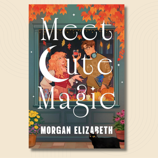 Book cover for 'Meet Cute Magic' by Morgan Elizabeth, featuring an autumn-themed illustration of a girl and boy sharing a moment outside a window, with orange leaves, flowers, and a black cat on a beige background.