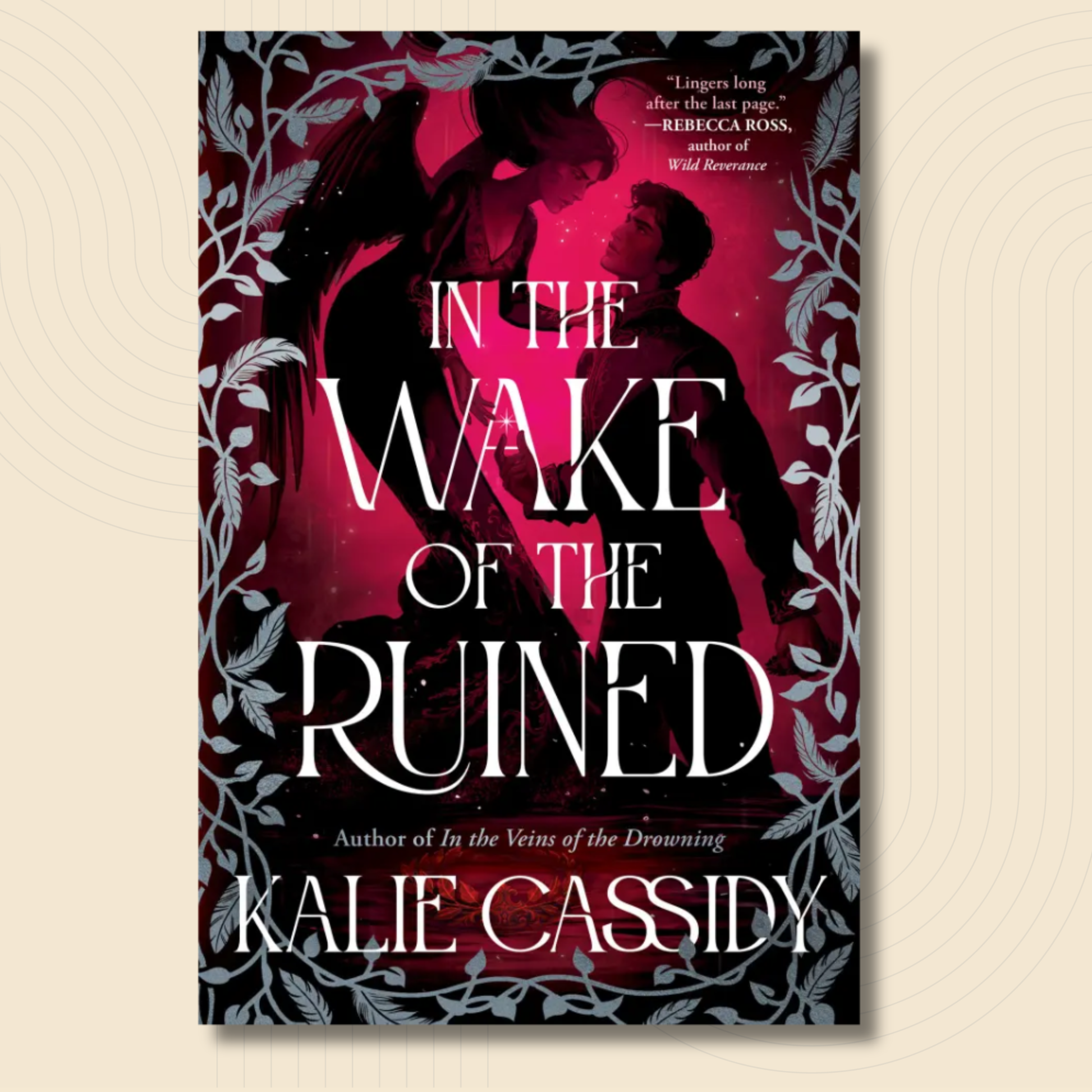 Book cover for 'In the Wake of the Ruined' by Kalie Cassidy, featuring a dark romantic design with silhouetted figures, a vivid magenta-pink glow, and white title text, shown against a light beige background.