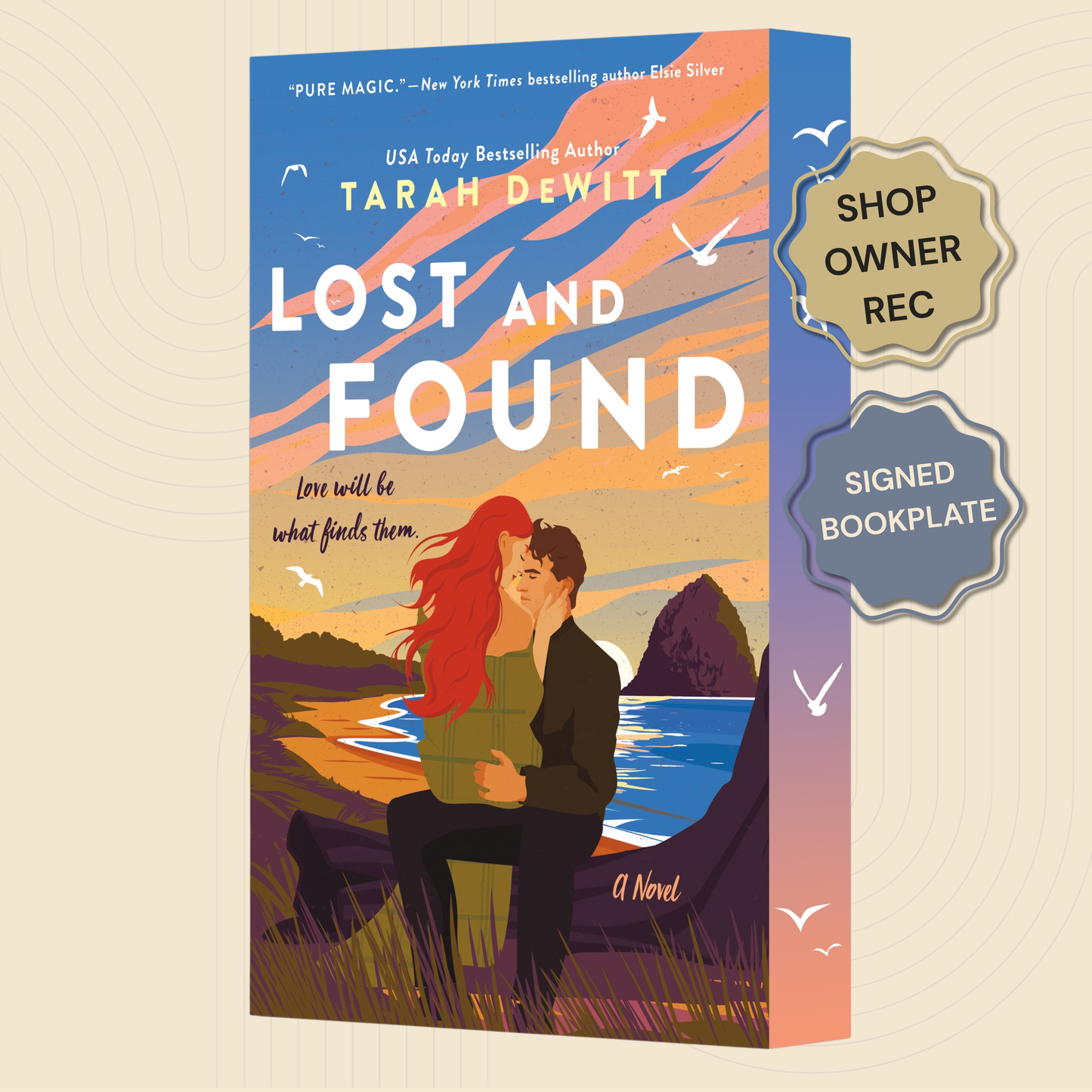 Book cover for the novel 'Lost and Found' by author Tarah Dewitt, shown as a 3D book box mockup on a beige background with two promotional badges reading 'Shop Owner Rec' and 'Signed Bookplate'. The cover features an illustrated couple by the water at sunset with birds flying overhead.