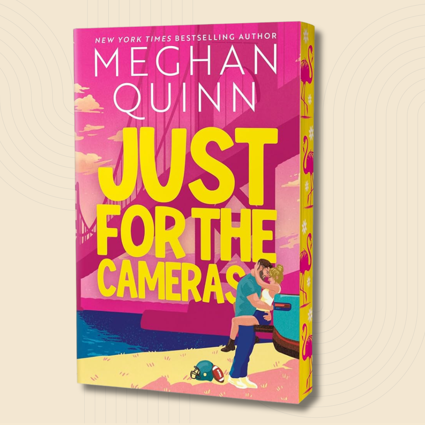 Book cover for 'Just for the Cameras' by Meghan Quinn, featuring a bright pink and yellow design with an illustration of a couple embracing by a car on a beach.