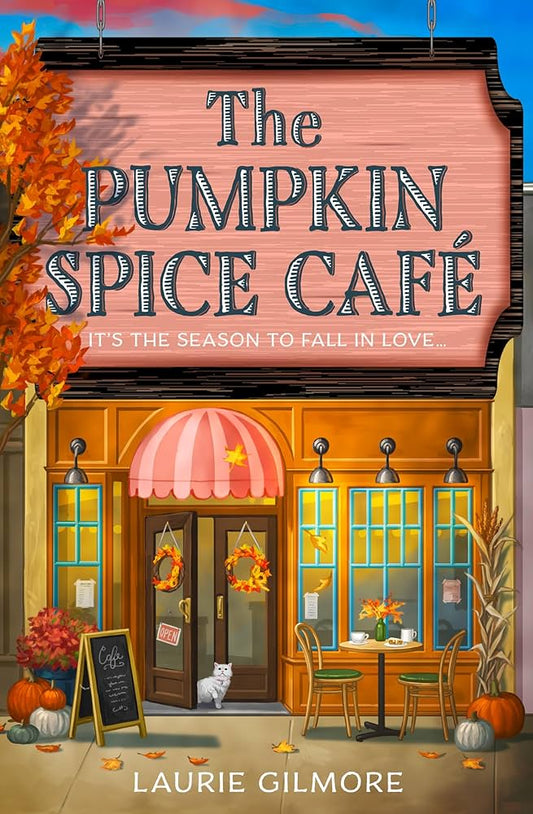 Illustration of 'The Pumpkin Spice Café' with autumn decorations and a cat outside.