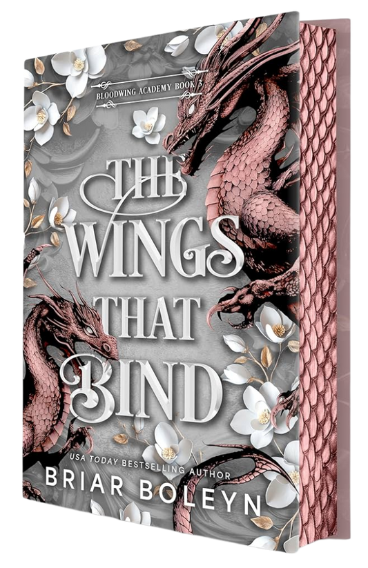 Book cover of 'The Wings That Bind' with dragons and floral design